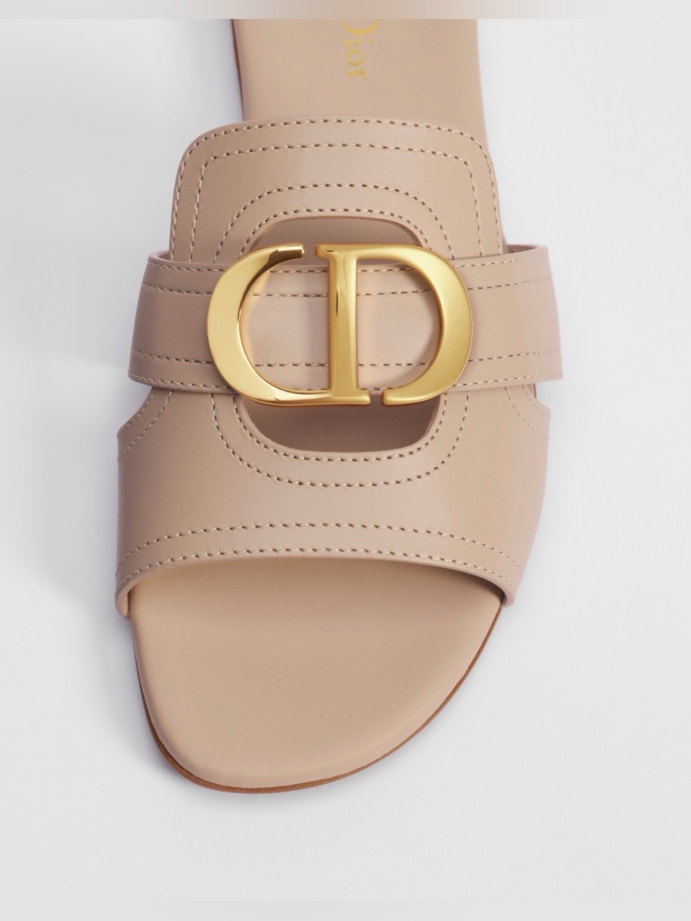 30 Montaigne Slide 
Dior Nude Leather Slide Sandal with Gold CD Buckle
